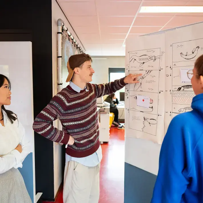 CMD - drie studenten en tekenbord